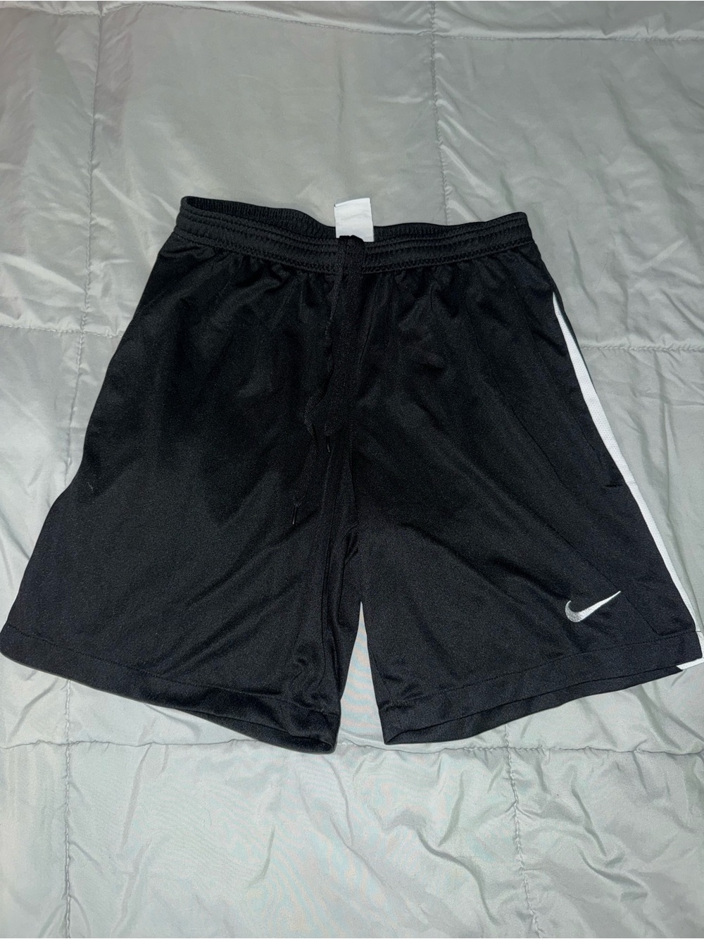 Nike Black Men's Athletic Shorts with White Swoosh and Side Stripe.